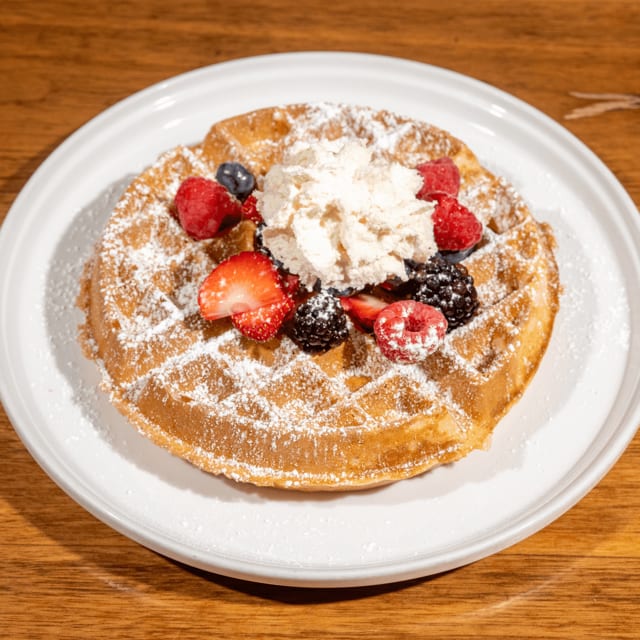 Vanilla Bean Waffle with Fresh Fruit & Whipped Cream.